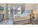 Bright bedroom with a modern dresser, serene decor, and views of the neighborhood at 7740 Sandy Ridge Dr # 236, Reunion, FL 34747