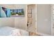 Bedroom with TV, view of the bathroom door, and a glimpse into the bathroom at 7740 Sandy Ridge Dr # 236, Reunion, FL 34747