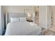 Serene bedroom featuring a comfortable bed, soft lighting, and neutral decor at 7740 Sandy Ridge Dr # 236, Reunion, FL 34747