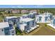 Eye-level view of modern townhomes shows off sleek architectural lines and optional roof decks in a well-planned community at 7740 Sandy Ridge Dr # 236, Reunion, FL 34747