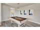 Bright game room featuring a pool table, modern art, and stylish light fixture at 7740 Sandy Ridge Dr # 236, Reunion, FL 34747