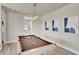 Stylish game room features a pool table, gray flooring, and a modern light fixture at 7740 Sandy Ridge Dr # 236, Reunion, FL 34747