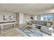 Upstairs living room with comfortable gray sofa, coffee table, pool table and gray neutral decor at 7740 Sandy Ridge Dr # 236, Reunion, FL 34747