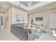 Open-concept living room featuring tile floors, a high ceiling, and modern furnishings at 7740 Sandy Ridge Dr # 236, Reunion, FL 34747