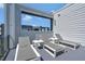 Stylish patio showcasing sun loungers and small tables, designed for relaxation in a contemporary setting at 7740 Sandy Ridge Dr # 236, Reunion, FL 34747