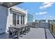 Modern outdoor patio featuring dining set and a grill, perfect for outdoor entertaining and relaxation at 7740 Sandy Ridge Dr # 236, Reunion, FL 34747