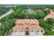 An aerial view shows the beautiful tree cover around this condo development at 7806 Sugar Brook Ct # 7806, Orlando, FL 32819