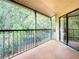 This balcony is screened in to keep out pests, while still letting in a refreshing breeze at 7806 Sugar Brook Ct # 7806, Orlando, FL 32819