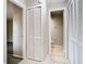 Hallway with neutral paint and access to bathroom and rooms at 7806 Sugar Brook Ct # 7806, Orlando, FL 32819