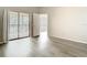Bright living room with sliding doors to a balcony and views to the connected space at 7806 Sugar Brook Ct # 7806, Orlando, FL 32819