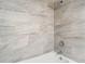Close up of the shower featuring stylish wall tiles and modern fixtures at 7806 Sugar Brook Ct # 7806, Orlando, FL 32819
