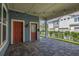 View of cozy back porch with brick pavers and string lights, offering a relaxing outdoor space at 7878 Greengard St, Orlando, FL 32827