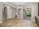 Dining area features tile flooring, a chandelier, and easy access to the backyard patio at 7878 Greengard St, Orlando, FL 32827