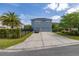 Inviting two-story home with a long driveway leading to a two-car garage at 7878 Greengard St, Orlando, FL 32827