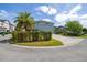 Charming blue two-story home with a palm tree and a spacious driveway at 7878 Greengard St, Orlando, FL 32827