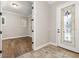 Foyer features tile flooring and a decorative glass front door, leading to a view of the office space at 7878 Greengard St, Orlando, FL 32827