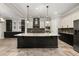 Bright kitchen with a center island, stainless steel appliances, and stylish countertops at 7878 Greengard St, Orlando, FL 32827