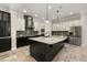 Well-equipped kitchen featuring a large island, stainless steel appliances, and ample cabinet space at 7878 Greengard St, Orlando, FL 32827