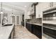 Gourmet kitchen featuring stainless steel appliances, granite countertops, and a central island at 7878 Greengard St, Orlando, FL 32827