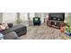Inviting living room featuring hardwood floors, large windows, and stylish furnishings at 7878 Greengard St, Orlando, FL 32827