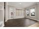 Bright living room with a decorative glass door and windows at 7878 Greengard St, Orlando, FL 32827