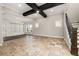 Large living room featuring coffered ceilings, tiled floors, and natural light at 7878 Greengard St, Orlando, FL 32827