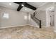 Open living room featuring a staircase and tiled floors at 7878 Greengard St, Orlando, FL 32827