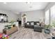 Bright living room with hardwood floors, comfortable seating, and plenty of natural light at 7878 Greengard St, Orlando, FL 32827