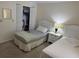 Cozy bedroom featuring two twin beds, closet, and neutral carpet at 8 Buck Cir # 8, Haines City, FL 33844