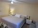 Serene bedroom with a comfortable bed, ceiling fan, and inviting decor at 8 Buck Cir # 8, Haines City, FL 33844