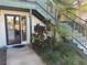 Charming condo entrance with a glass door, tasteful landscaping, and a welcoming pathway at 8 Buck Cir # 8, Haines City, FL 33844