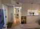 Inviting foyer with hardwood floors, a cozy rug, and a glimpse into the adjacent kitchen area at 8 Buck Cir # 8, Haines City, FL 33844