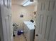 Functional laundry room with washer, dryer, and storage space at 8 Buck Cir # 8, Haines City, FL 33844