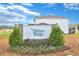 The Wekiva Ridge neighborhood sign is surrounded by lush landscaping on a sunny day at 808 Wekiva Ridge Dr, Mount Dora, FL 32757
