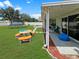 Spacious backyard with a covered patio, a picnic table, and a trampoline at 8439 Adele Rd, Lakeland, FL 33810