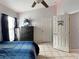 This bedroom has tiled floor, a ceiling fan, and a chest of drawers at 8439 Adele Rd, Lakeland, FL 33810