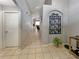 Tile hallway offering an open layout with decorative wall art and neutral paint at 8439 Adele Rd, Lakeland, FL 33810