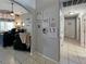 Hallway leading to the living room and bedrooms, all with tiled flooring at 8439 Adele Rd, Lakeland, FL 33810