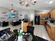 Open-concept living space features a kitchen, dining area, and living room in a bright, spacious layout at 8439 Adele Rd, Lakeland, FL 33810