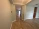 Inviting home entryway featuring wood-look flooring and neutral wall paint at 878 Benjamin Trl, Davenport, FL 33837
