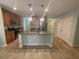 Modern kitchen with granite countertops, stainless steel appliances, and tile flooring at 878 Benjamin Trl, Davenport, FL 33837