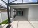 Enclosed patio featuring concrete flooring and a ceiling fan at 878 Benjamin Trl, Davenport, FL 33837