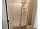 Bathroom features a stand up shower with a glass door and tiled walls for a clean look at 9079 Dogleg Dr, Davenport, FL 33896