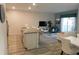 Open-concept floor plan connecting the kitchen, dining and living areas, perfect for modern living at 9079 Dogleg Dr, Davenport, FL 33896