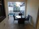 Outdoor patio features comfortable seating and a view of the private pool and lounging area at 9079 Dogleg Dr, Davenport, FL 33896
