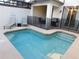 This backyard oasis features a private pool, spa, grill area, and lounging space for ultimate relaxation at 9079 Dogleg Dr, Davenport, FL 33896