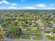 Residential neighborhood features lush trees, manicured lawns, and well-maintained homes at 98 Pinata Ct, Kissimmee, FL 34743