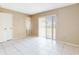 Bright bedroom featuring tiled flooring and a large window at 98 Pinata Ct, Kissimmee, FL 34743