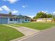 Single-story home with a well-kept lawn and a driveway at 98 Pinata Ct, Kissimmee, FL 34743