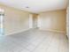 Open living room with tiled flooring and neutral paint at 98 Pinata Ct, Kissimmee, FL 34743